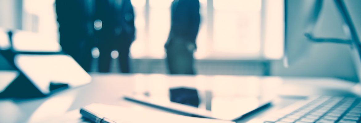 For business Business devices and documents at the workplace, unrecognized businesspeople sharing the ideas on the background