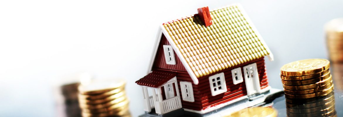 House and money Little house and lot of money isolated on white